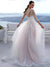 Robe de mariée chic et classe vue dos en dentelle fine avec manches longues transparentes, dos illusion brodé et jupe fluide en tulle ivoire légèrement rosé, traîne élégante.