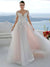 Robe de mariée chic et classe en tulle ivoire et dentelle délicate, coupe princesse avec manches longues et jupe fluide volumineuse, silhouette élégante et romantique.