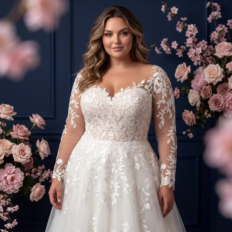 Robe de mariée grande taille en dentelle à manches longues sur décor floral
